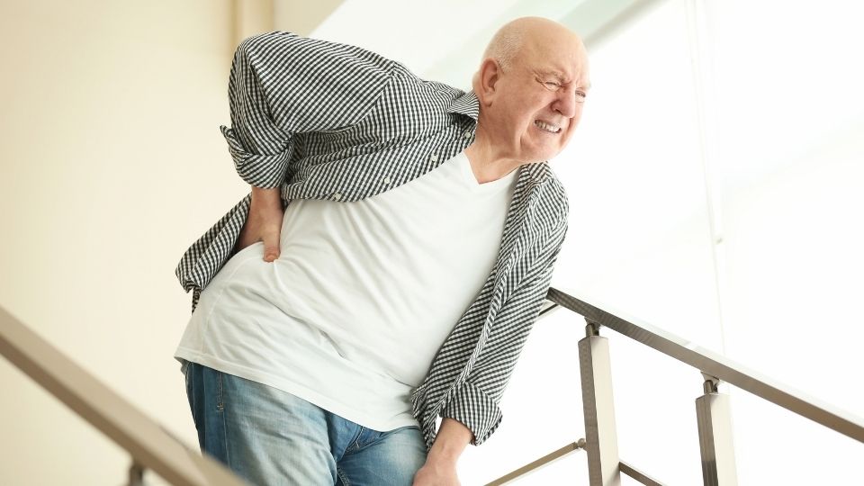 An Elderly Man Suffering From Mid Back Pain in Davie